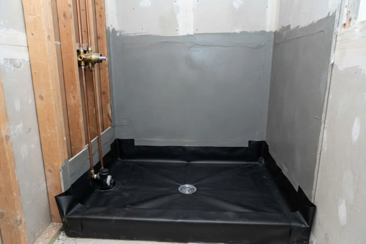 Shower valve and waterproofing membrane before tile installation