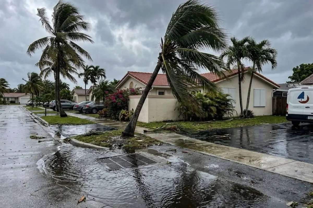 Rainwater pooled at a storm drain on a South Florida street