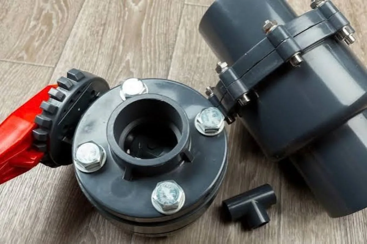 Sump pit in a South Florida garage with pump, float and check valve