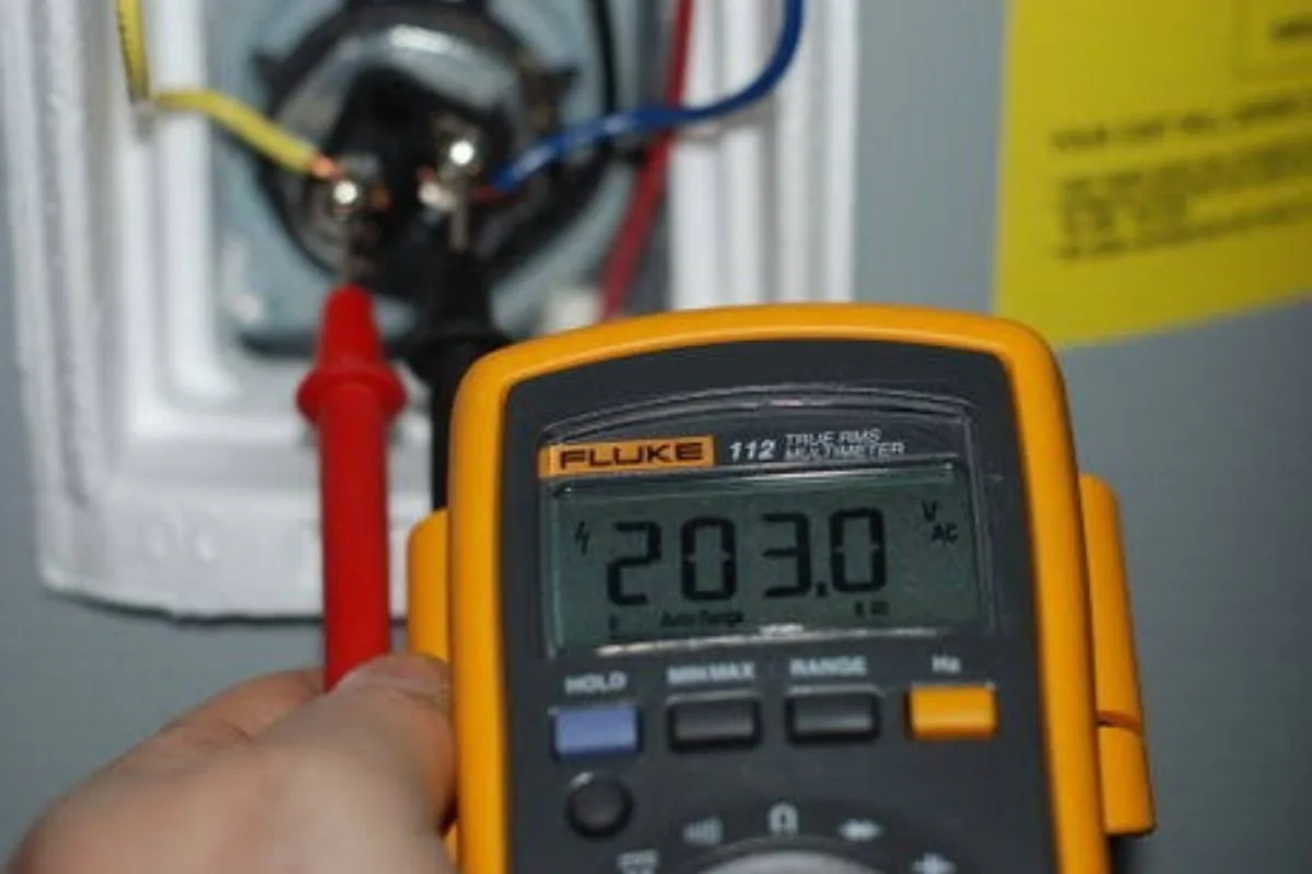 Electric water heater element and thermostat being tested